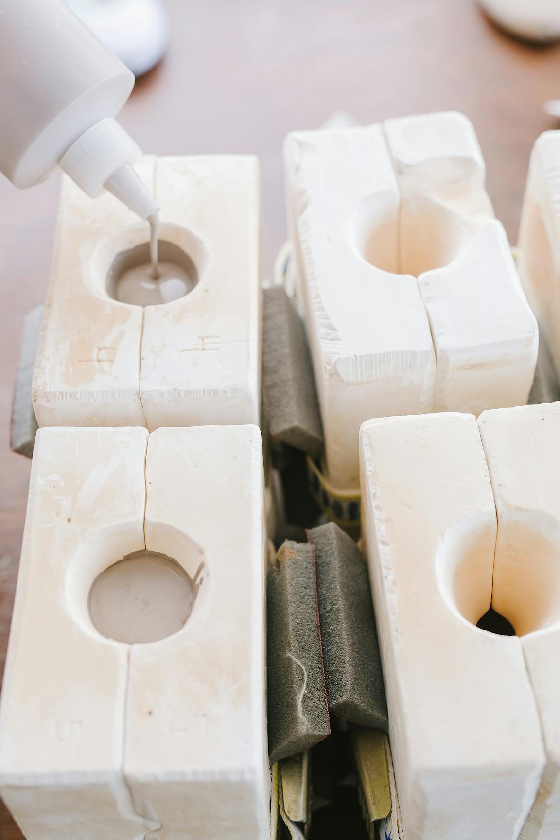 Ceramic is poured into one of four ceramic molds.
